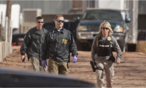 Criminal Defense Law Firm - Law enforcement officers investigate in Hildale, Utah, Photograph by Chris Caldwell
